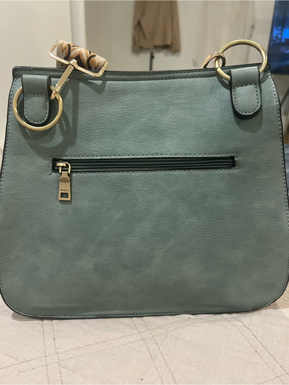 Green Leather Crossbody Bag with Decorative Tassel and Patterned Strap - Picture 4 of 6